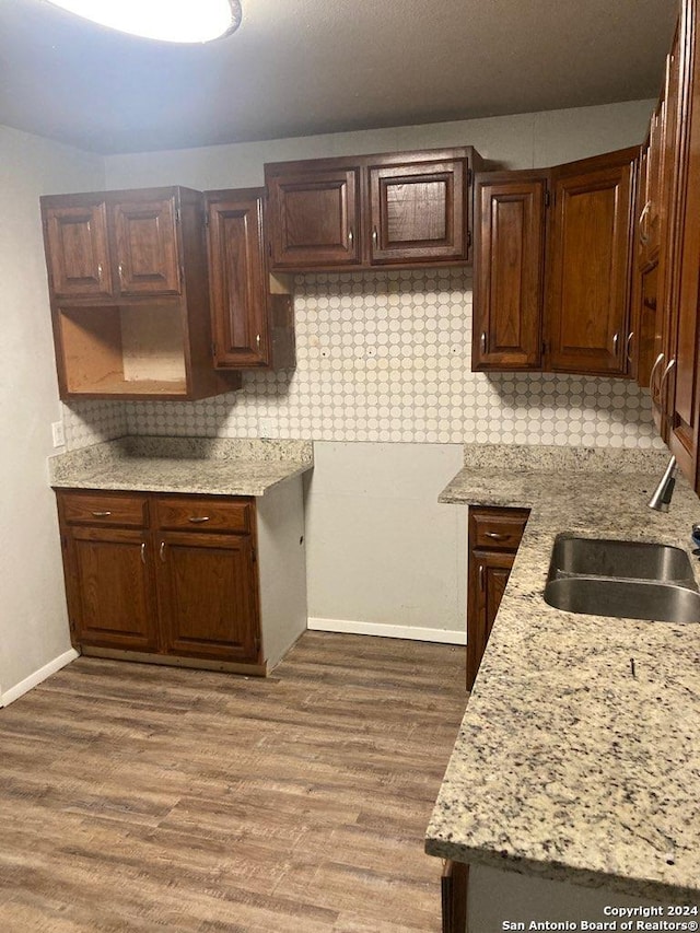 kitchen with hardwood / wood-style floors and sink