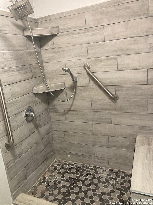 bathroom with tiled shower