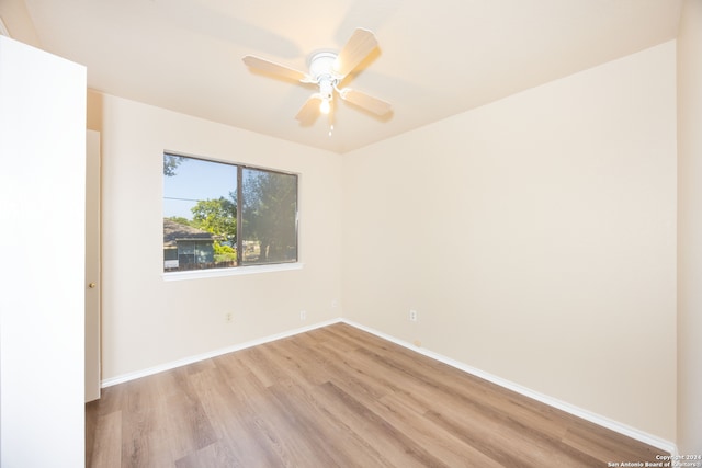 unfurnished room featuring light hardwood / wood-style floors and ceiling fan