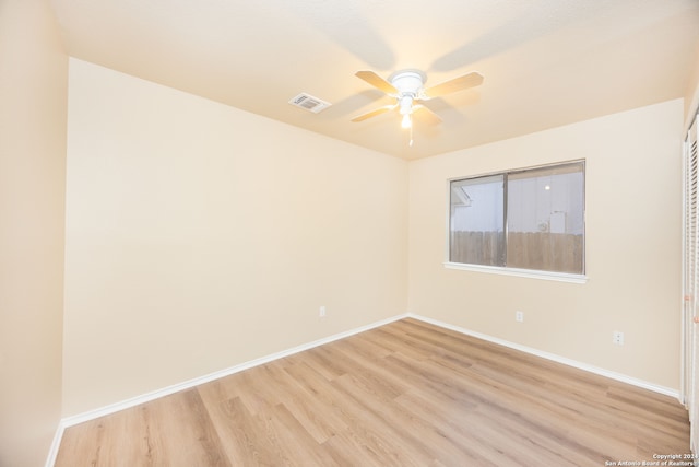 unfurnished room featuring ceiling fan and light wood-type flooring