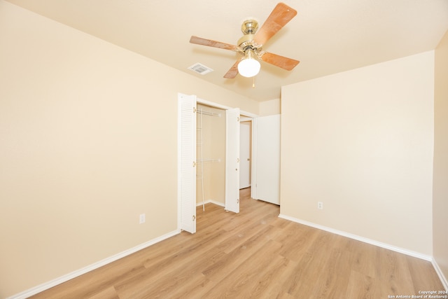 unfurnished bedroom with a closet, ceiling fan, and light wood-type flooring