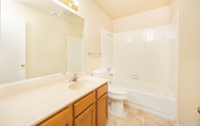 full bathroom featuring tiled shower / bath, vanity, and toilet