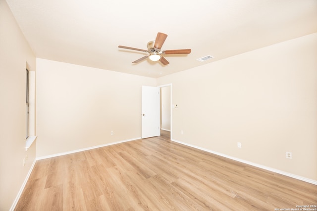 unfurnished room with ceiling fan and light hardwood / wood-style floors