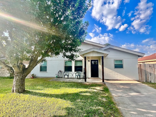 view of front of home with a front yard