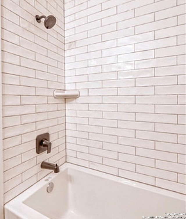 448 Melody, Uvalde, TX 78801 - full bathroom featuring shower / tub combination