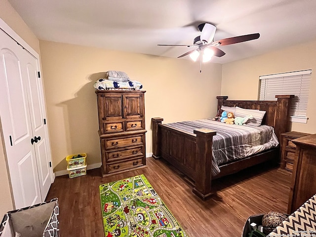 bedroom featuring ceiling fan, dark wood-type flooring, and a closet