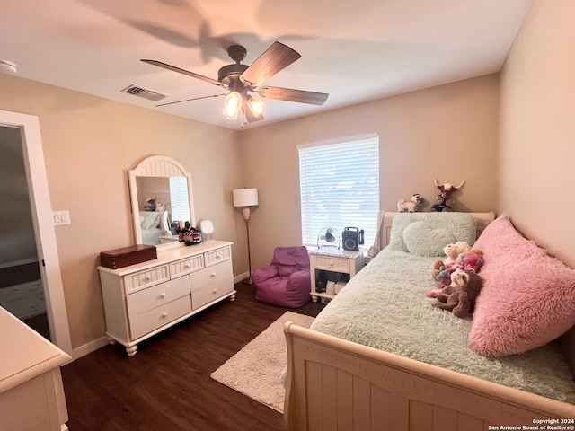 bedroom with ceiling fan and dark hardwood / wood-style floors