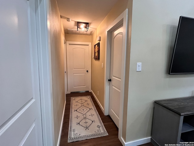 hall featuring dark wood-type flooring