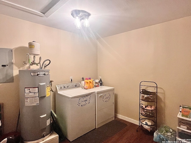 laundry room with electric water heater, electric panel, dark hardwood / wood-style floors, and washer and clothes dryer