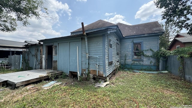 rear view of house with a lawn