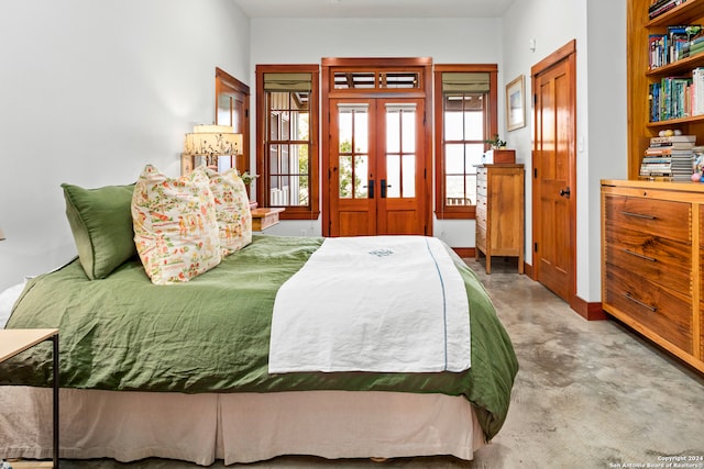 carpeted bedroom featuring french doors and a closet