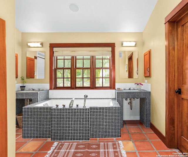 full bathroom featuring a bath and tile patterned floors