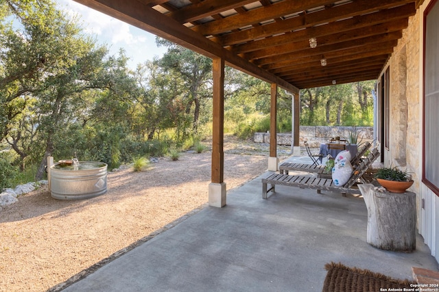 view of patio / terrace featuring fence