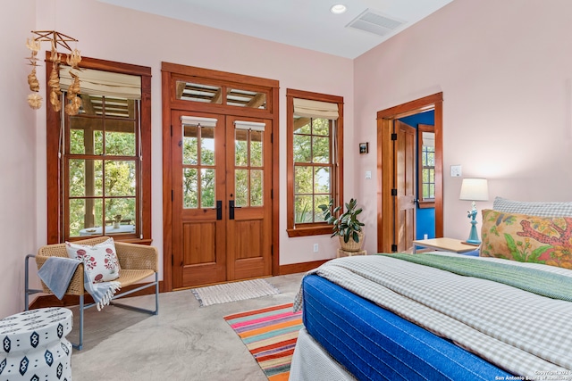 bedroom featuring french doors and carpet floors