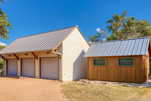 garage featuring driveway