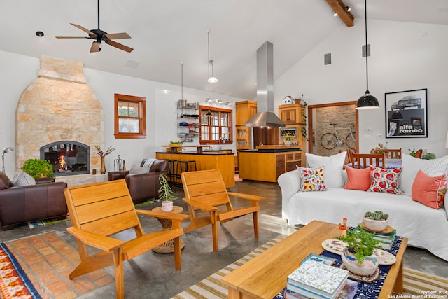 tiled living room featuring a fireplace, high vaulted ceiling, beamed ceiling, ceiling fan, and sink