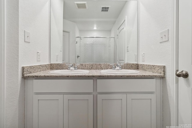 bathroom with vanity and walk in shower