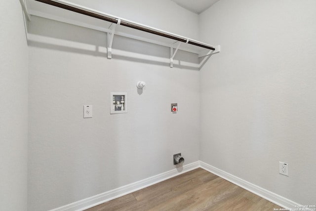 washroom with hardwood / wood-style flooring, gas dryer hookup, and hookup for a washing machine