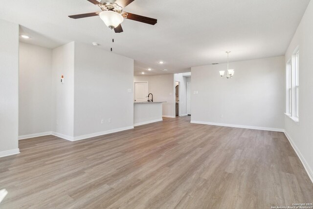 spare room featuring carpet flooring, ceiling fan, and a tray ceiling