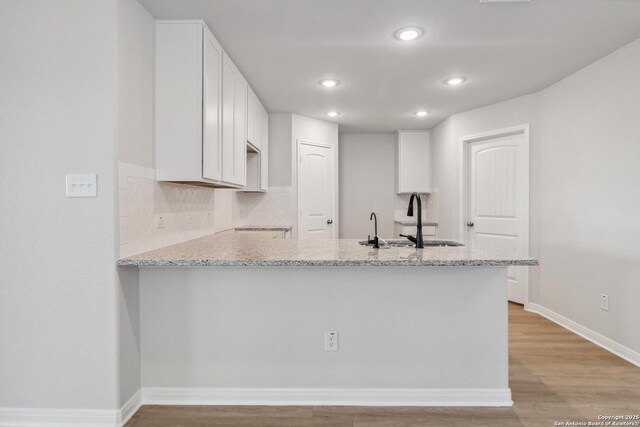 empty room featuring a raised ceiling and carpet floors