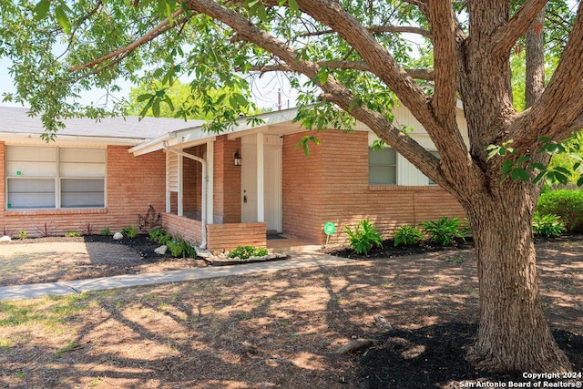 view of front of home featuring brick siding