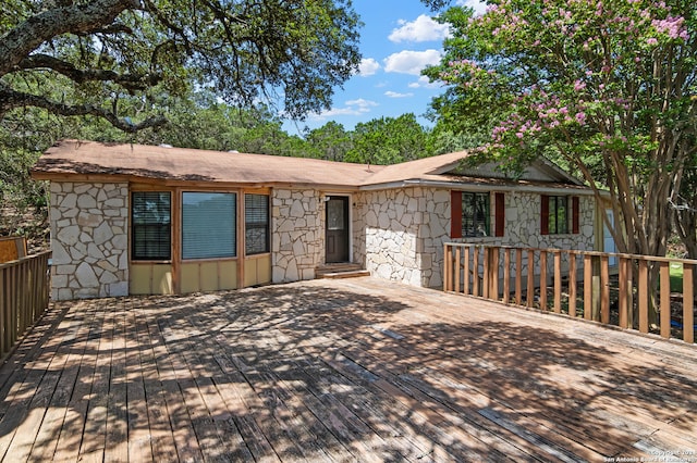 view of front of property with a wooden deck