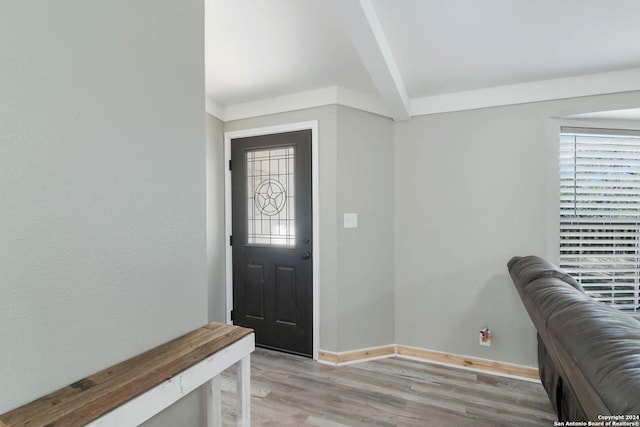 202 Cedar Hill Rd, Pipe Creek, TX 78063 - foyer entrance with light wood-type flooring, baseboards, and beam ceiling