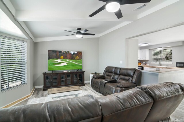 202 Cedar Hill Rd, Pipe Creek, TX 78063 - living room with baseboards, light wood-style flooring, visible vents, and ceiling fan