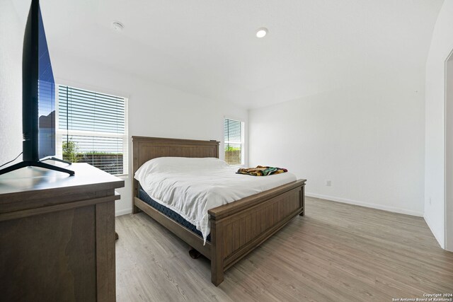 bedroom with light hardwood / wood-style flooring