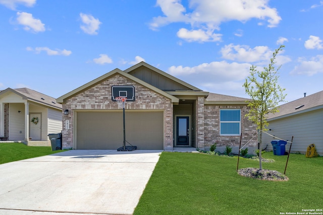 view of front of house with a front lawn and a garage