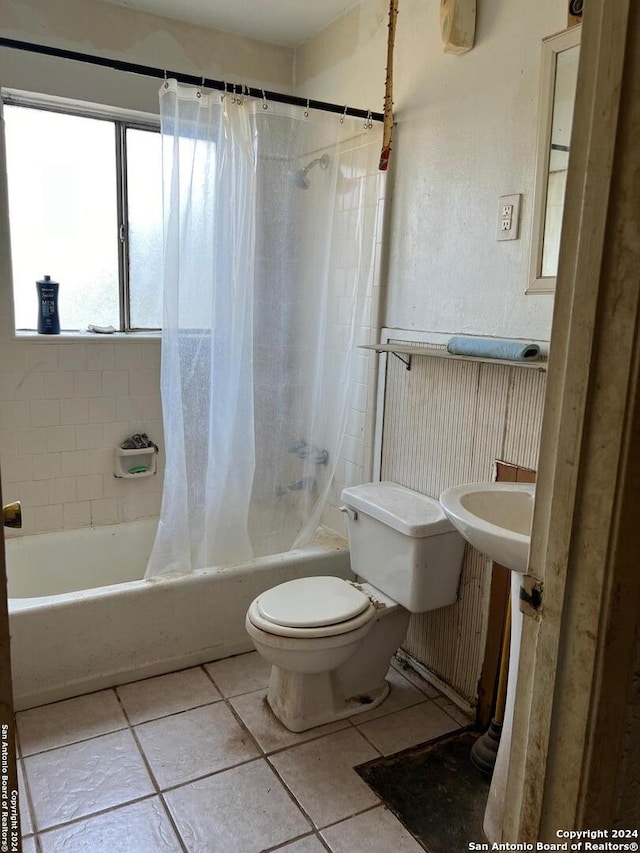 bathroom with tile patterned flooring, toilet, and shower / bathtub combination with curtain