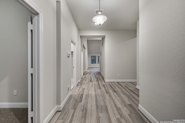 hallway with wood-type flooring