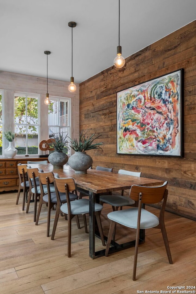 215 Beauregard, San Antonio, TX 78204 - dining room featuring light wood-style floors and wood walls