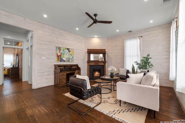 215 Beauregard, San Antonio, TX 78204 - living area featuring visible vents, ceiling fan, a warm lit fireplace, and hardwood / wood-style flooring