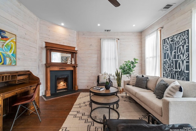 215 Beauregard, San Antonio, TX 78204 - living area with visible vents, dark wood-style flooring, wooden walls, a lit fireplace, and recessed lighting