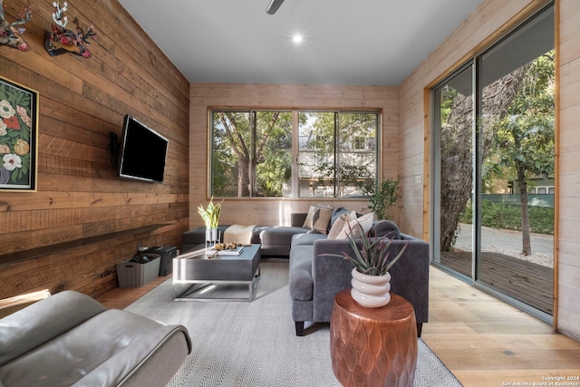 215 Beauregard, San Antonio, TX 78204 - living area featuring light wood-type flooring and wooden walls