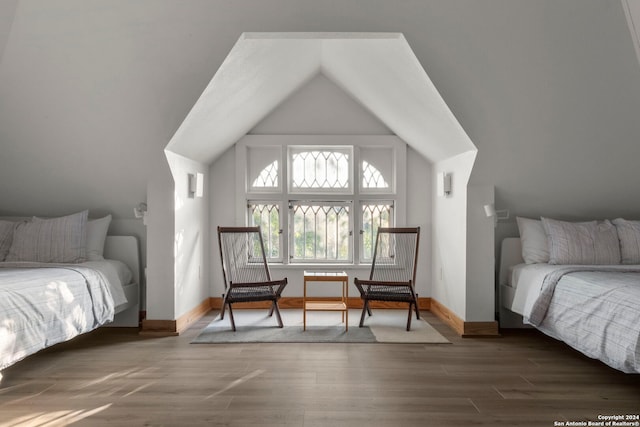 215 Beauregard, San Antonio, TX 78204 - bedroom with baseboards, vaulted ceiling, and wood finished floors