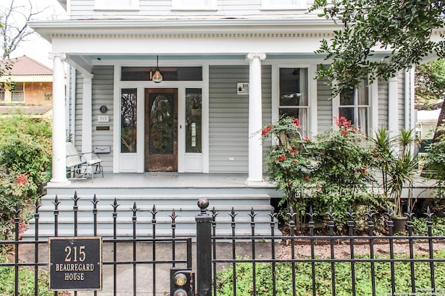 215 Beauregard, San Antonio, TX 78204 - view of exterior entry with a porch and fence