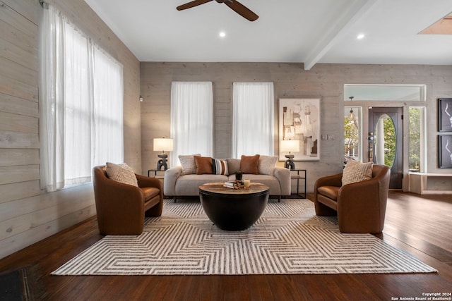 215 Beauregard, San Antonio, TX 78204 - living room with wooden walls, ceiling fan, beam ceiling, and hardwood / wood-style flooring