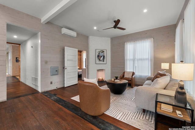 215 Beauregard, San Antonio, TX 78204 - living room featuring wood walls, a brick fireplace, wood finished floors, ceiling fan, and a wall unit AC