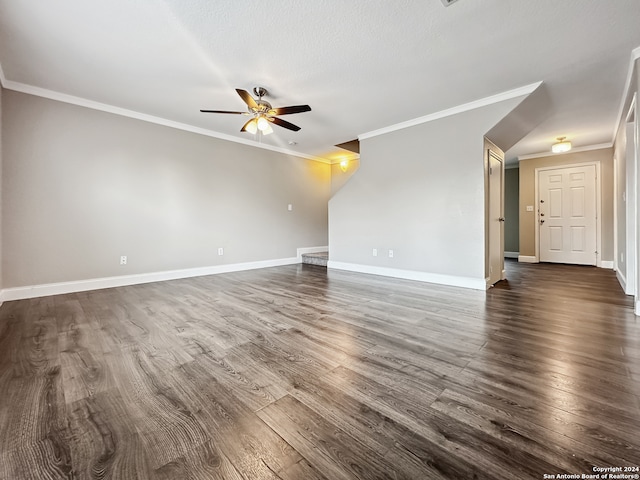 unfurnished room with ceiling fan, wood-type flooring, a textured ceiling, and ornamental molding