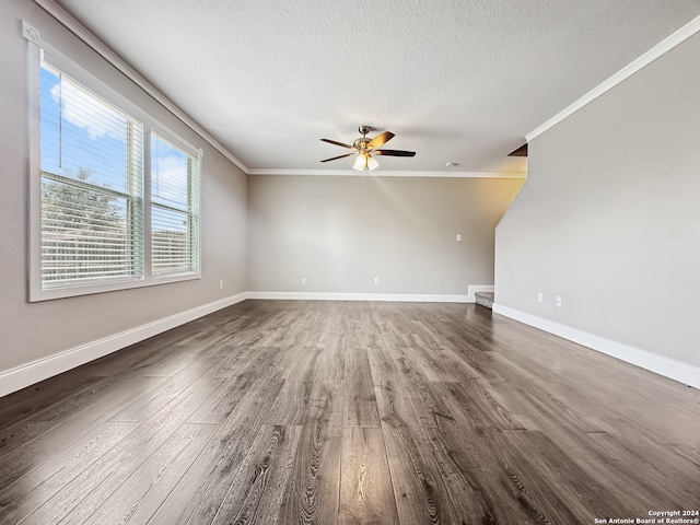 unfurnished living room featuring hardwood / wood-style floors, crown molding, a textured ceiling, and ceiling fan