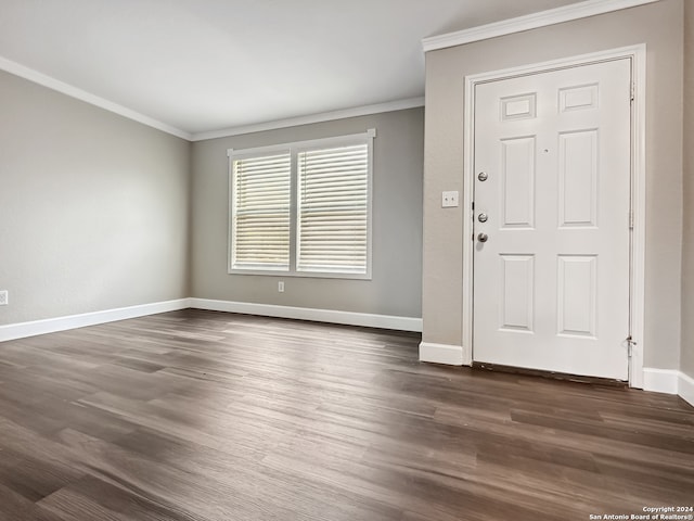 entryway with hardwood / wood-style floors and ornamental molding