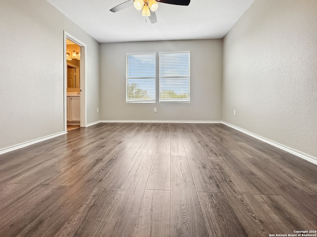 empty room featuring wood-type flooring and ceiling fan