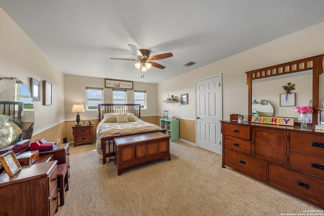 bedroom featuring ceiling fan and light carpet