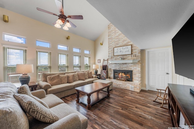 living room with ceiling fan, a fireplace, a healthy amount of sunlight, and dark hardwood / wood-style floors