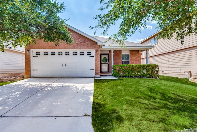 view of front of house with a front lawn and a garage