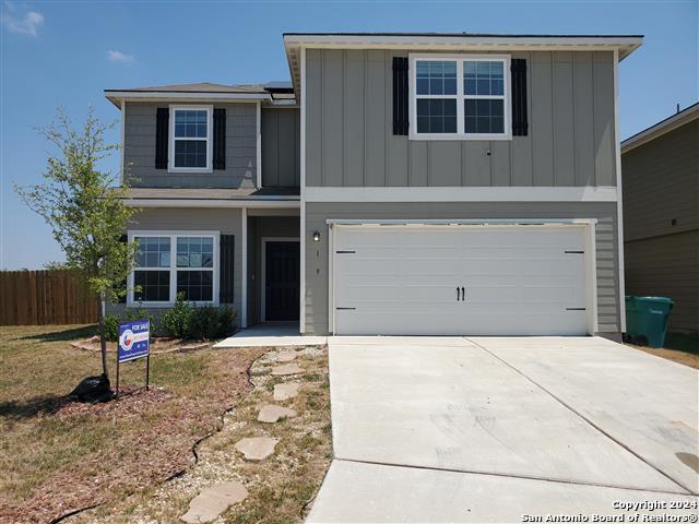 front of property with a garage