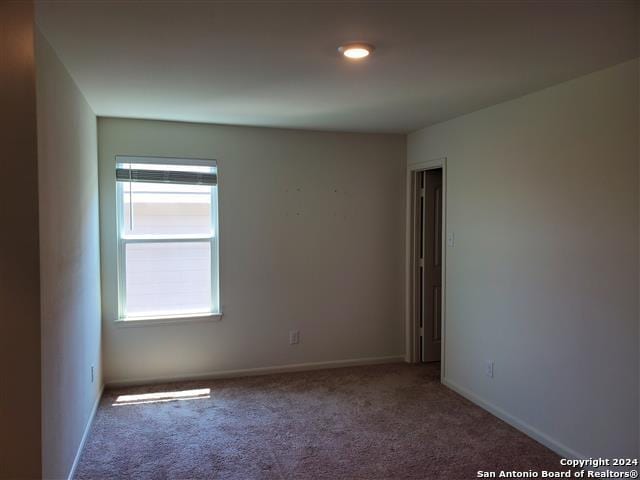 unfurnished room featuring carpet floors