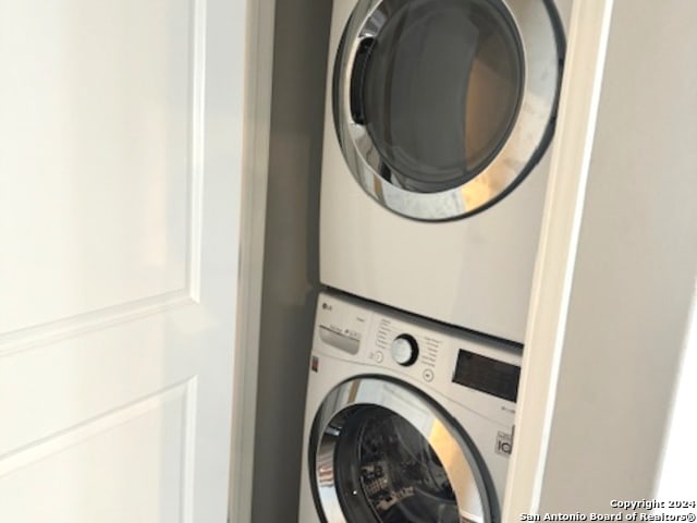 laundry area featuring stacked washer and clothes dryer